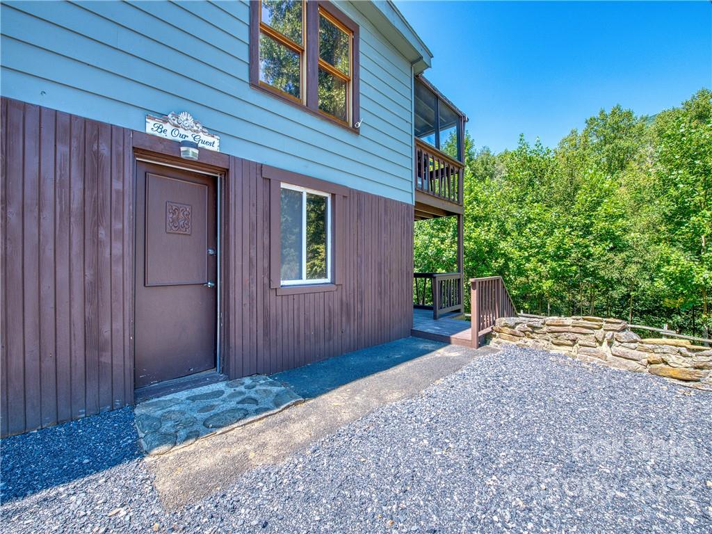 5474 Soco Road Maggie Valley, NC 28751 - Photo 22 of 48 a backyard of a house with table and chairs