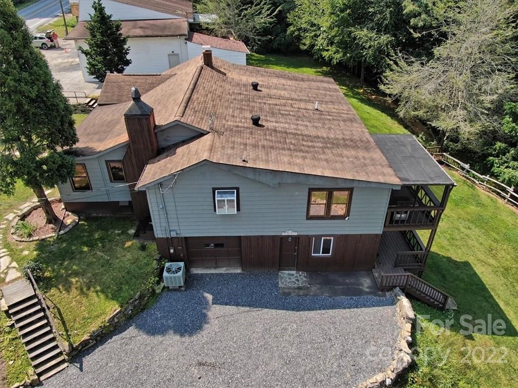 5474 Soco Road Maggie Valley, NC 28751 - Photo 3 of 48 an aerial view of a house with a yard