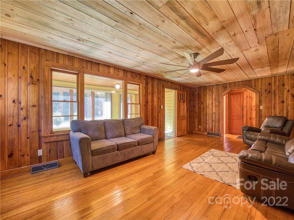 5474 Soco Road Maggie Valley, NC 28751 - Photo 7 of 48 a living room with furniture and wooden floor