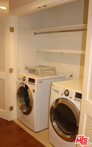 a bathroom with a toilet a sink and shower