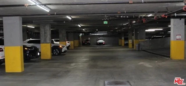 a view of a room with rack and wooden fencing
