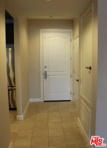 a kitchen with stainless steel appliances a stove and a microwave