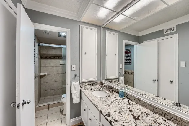 a bathroom with a tub and shower