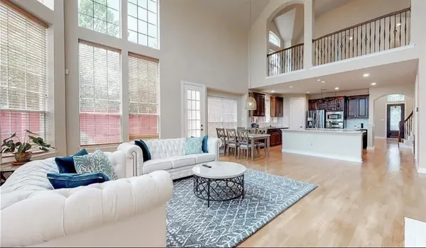 a living room with furniture and a table