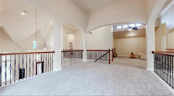 a view of a hallway with livingroom