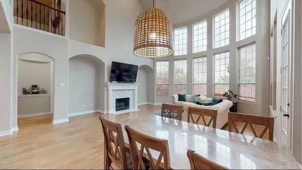 a view of a dining room with furniture window and wooden floor