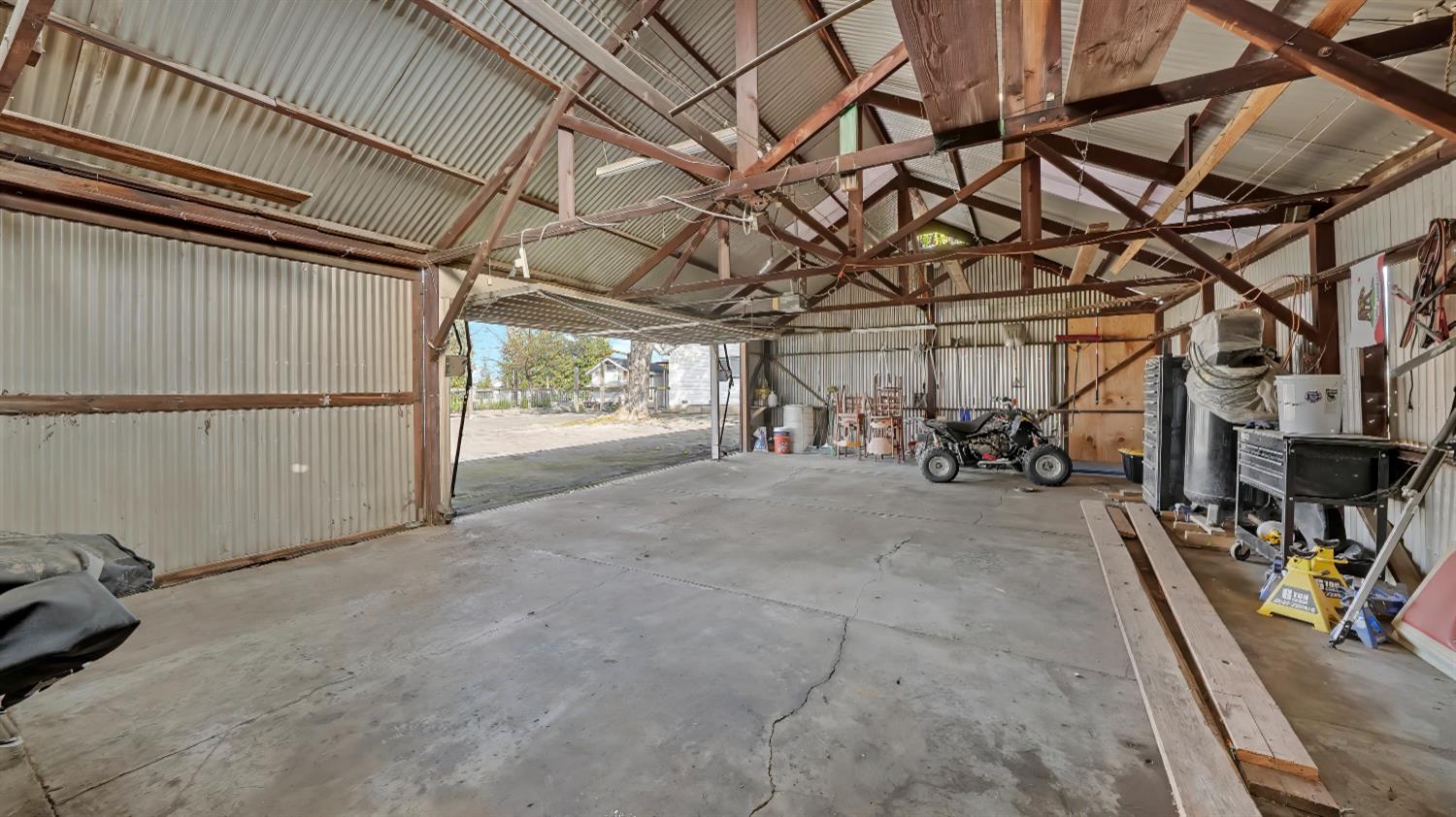 41709 Road 52 Reedley, CA 93654 - Photo 13 of 52 a view of a garage with storage