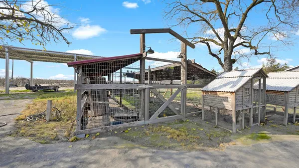 a view of a house with backyard porch and sitting area
