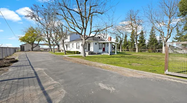 a view of a house with a big yard