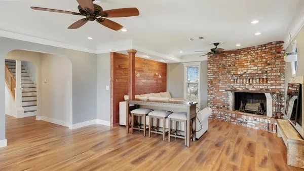 a living room with furniture a fireplace and a table
