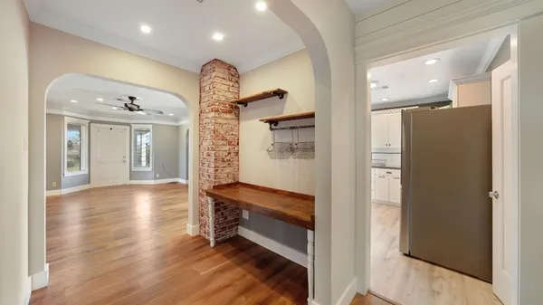 a view of gallery with wooden floor