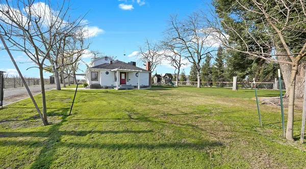 a view of a house with a big yard