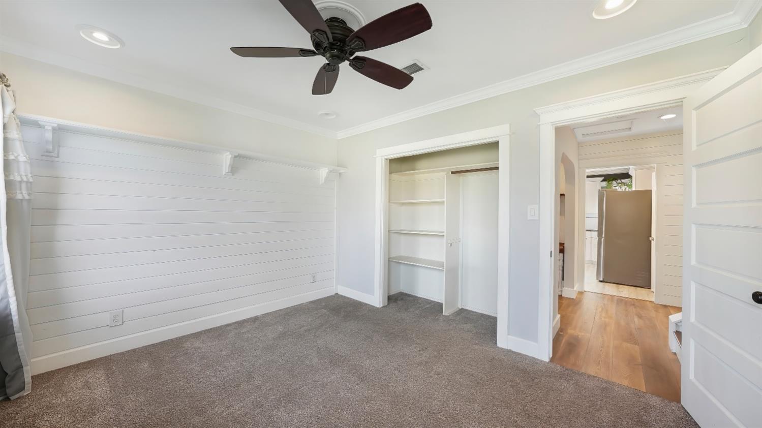 41709 Road 52 Reedley, CA 93654 - Photo 31 of 52 an empty room with closet and a ceiling fan