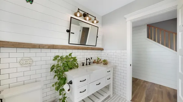 a bathroom with a sink and mirror