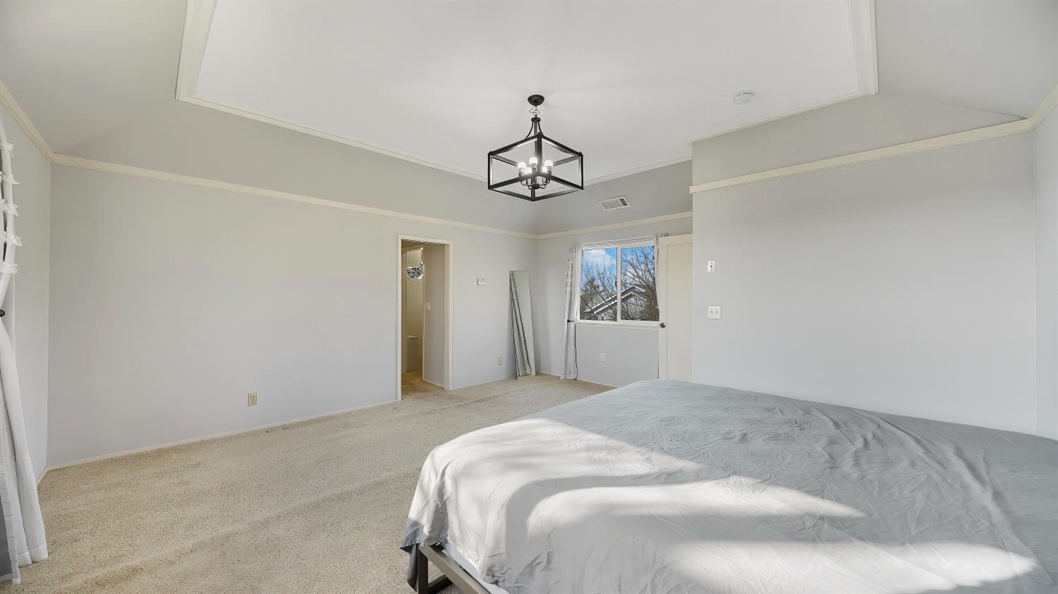 41709 Road 52 Reedley, CA 93654 - Photo 42 of 52 a spacious bedroom with a bed and window