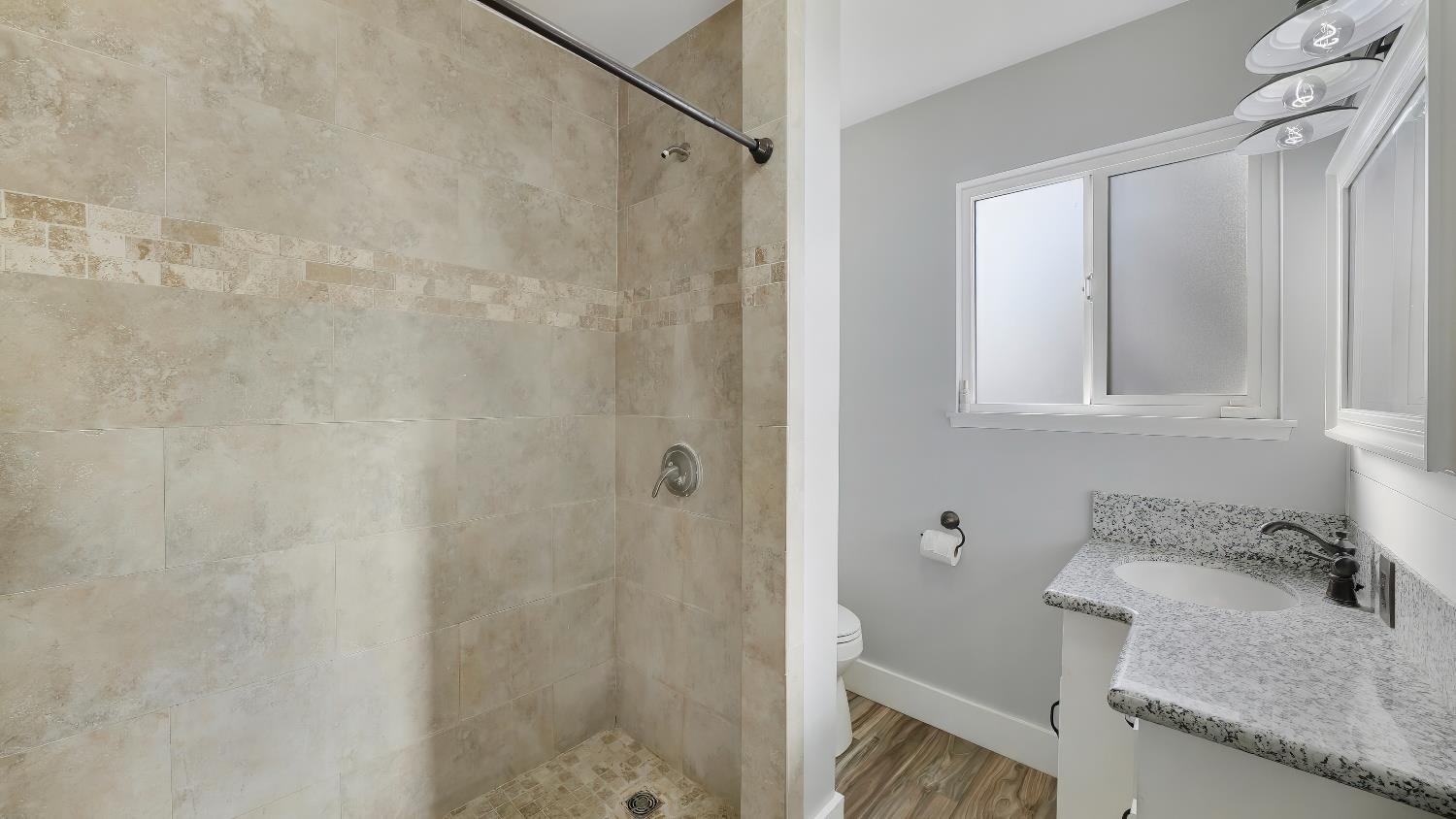 41709 Road 52 Reedley, CA 93654 - Photo 45 of 52 a bathroom with a granite countertop sink and a mirror