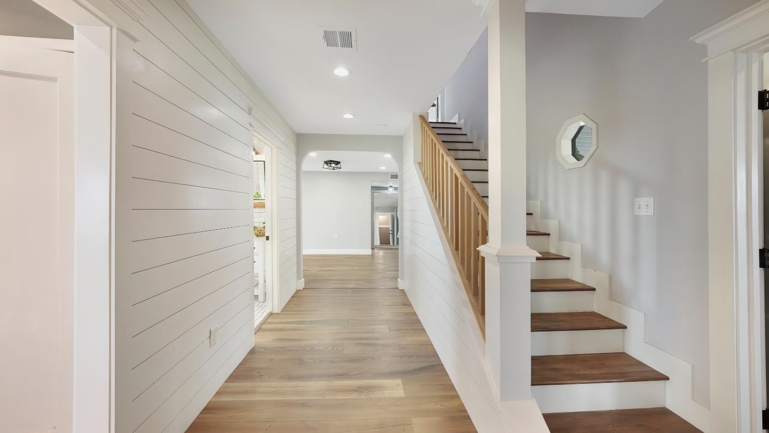 41709 Road 52 Reedley, CA 93654 - Photo 46 of 52 a view of a hallway with wooden floor and staircase