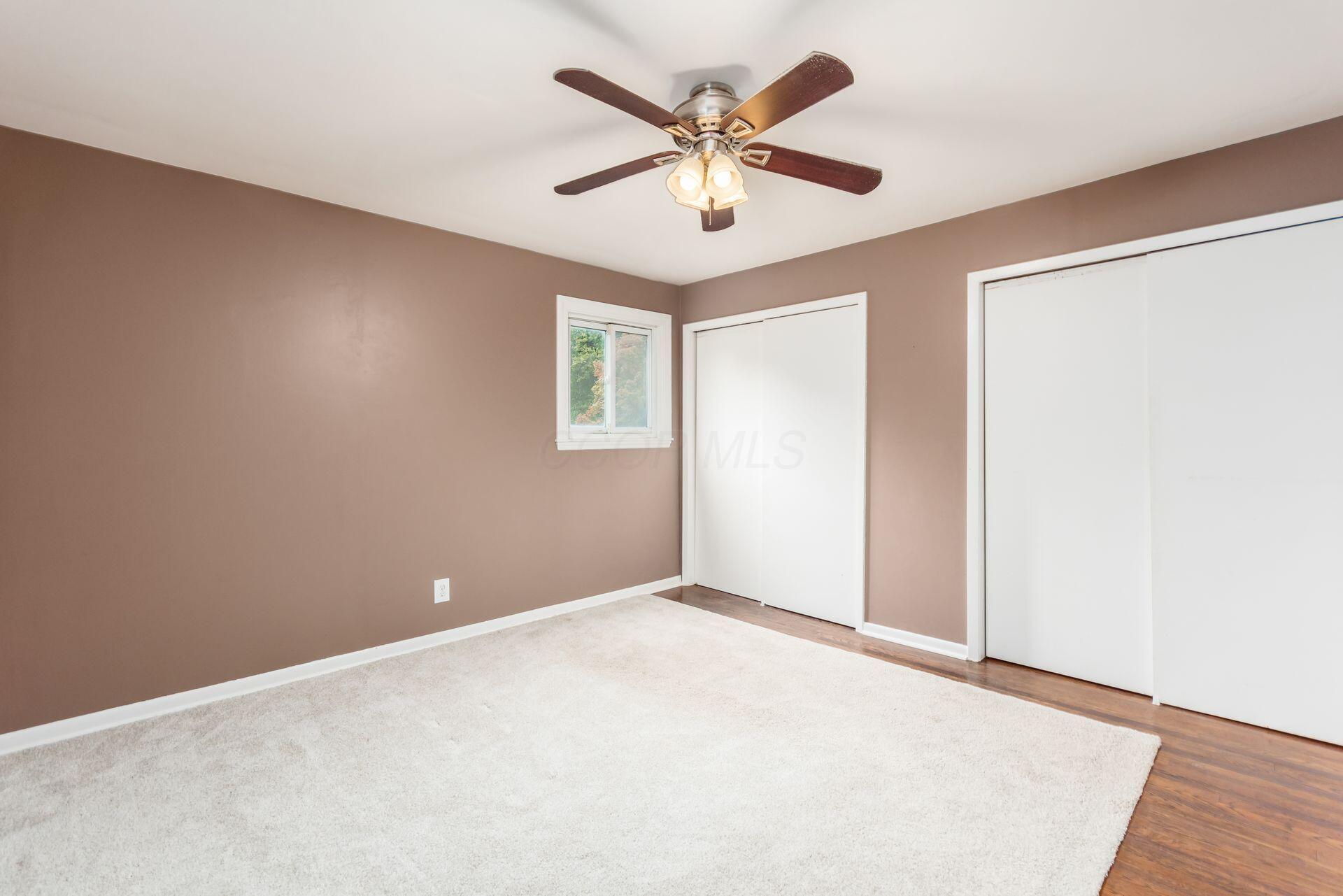 9221 London Road Orient, OH 43146 - Photo 32 of 51 Primary bedroom with overhead fan and hardwood floors measures 12'9" x 12'11"