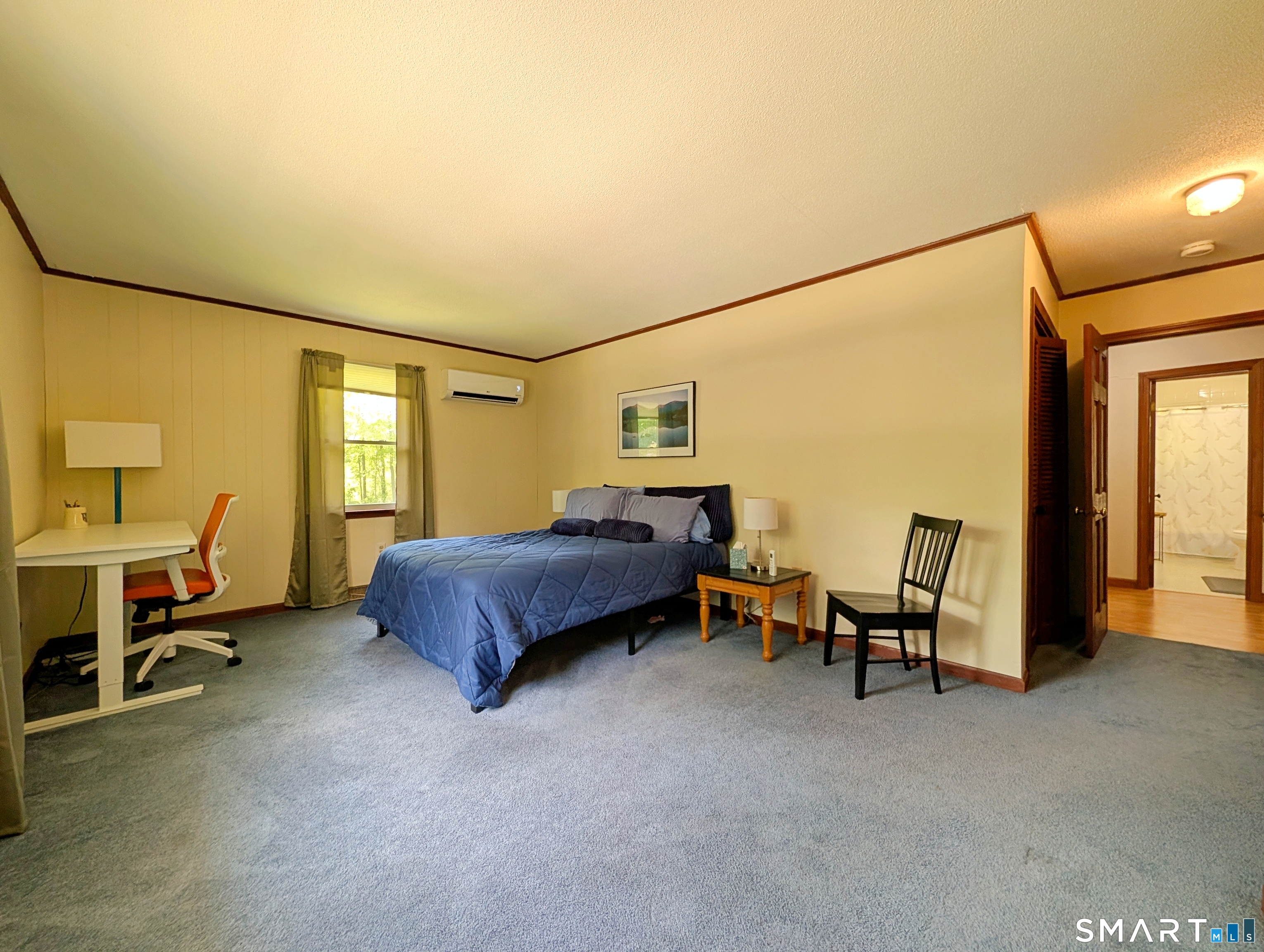 17 Colebrook Road Norfolk, CT 06058 - Photo 16 of 21 a spacious bedroom with a bed and a chair in it