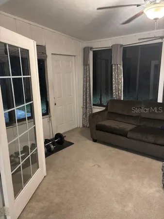 a view of bedroom with furniture and closet
