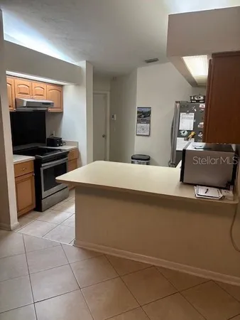 a bedroom with a bed and a television