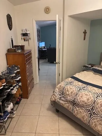 a bedroom with a bed and dresser
