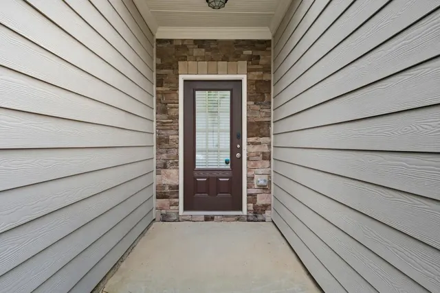a large kitchen with kitchen island a sink stainless steel appliances and cabinets