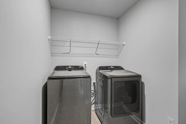 a house view with swimming pool and trees in the background