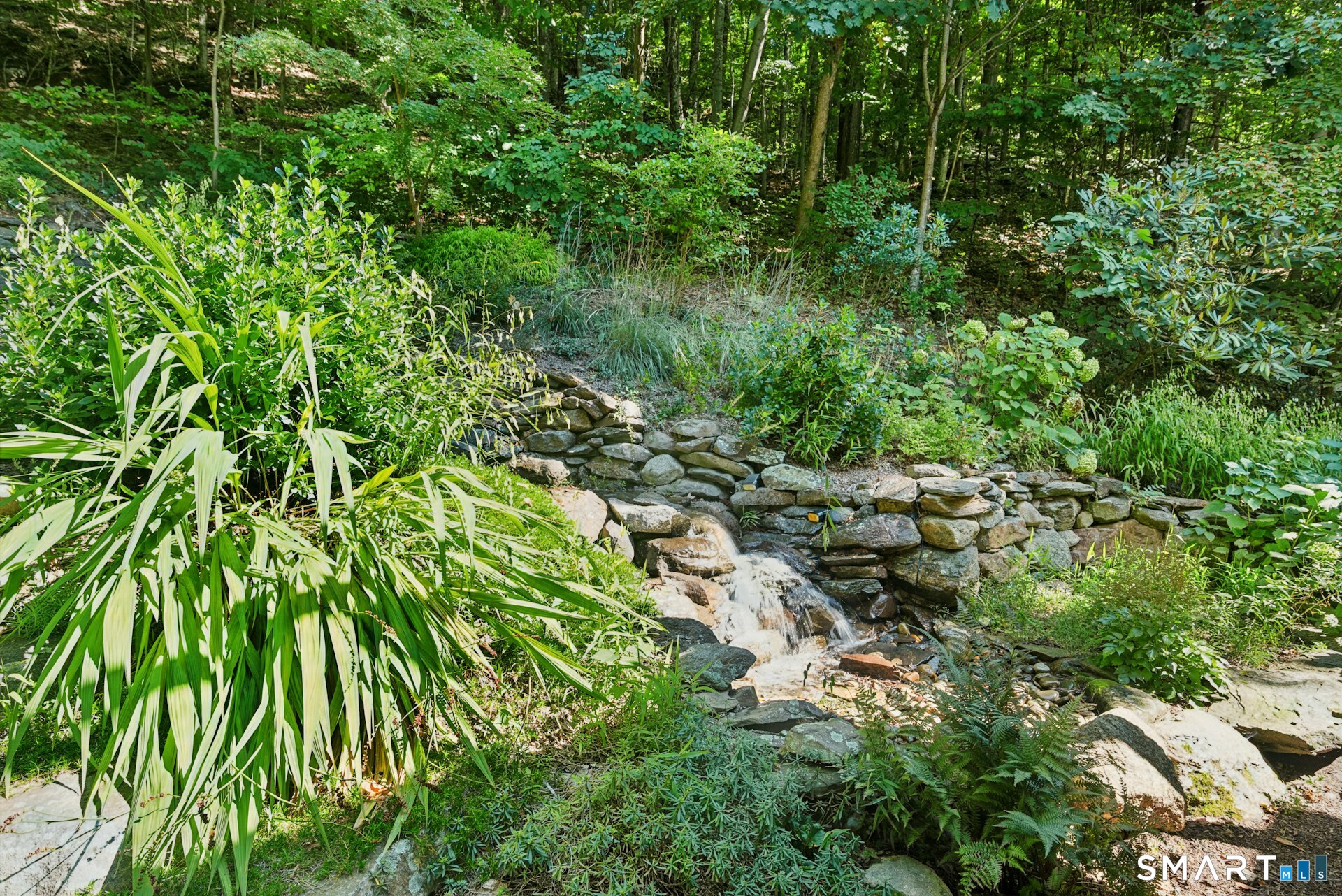 9 Teachers Ridge Road Newtown, CT 06482 - Photo 34 of 35 Waterfall designed by Holmes Fine Gardens