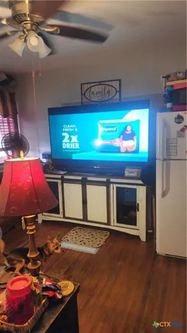 a room with furniture and a flat screen tv