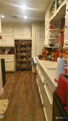 a kitchen with stainless steel appliances a stove a sink and a refrigerator