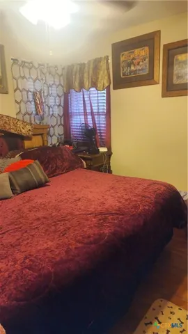 a bed sitting in a bedroom next to a wall