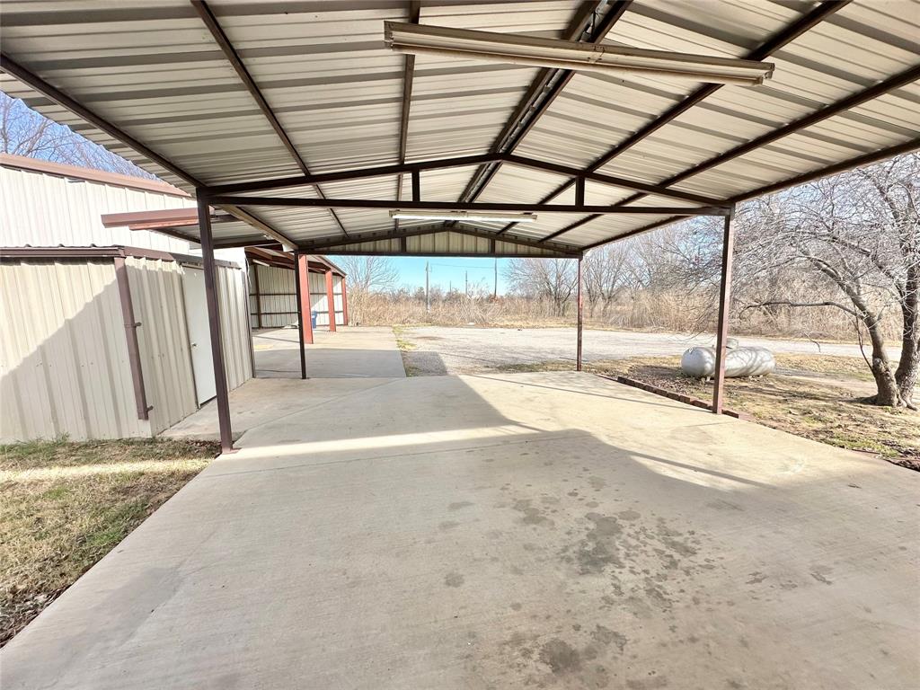 8869 Liberty Road Aubrey, TX 76227 - Photo 22 of 25 a view of a backyard of a house
