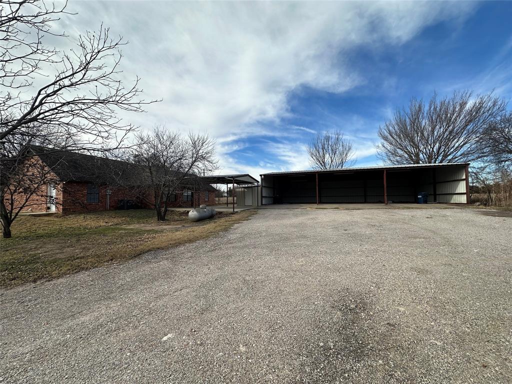 8869 Liberty Road Aubrey, TX 76227 - Photo 24 of 25 a view of a house with a yard