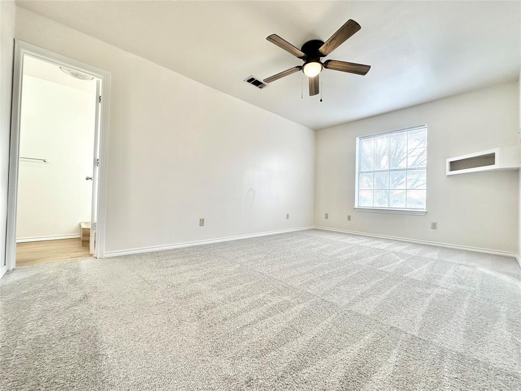 8869 Liberty Road Aubrey, TX 76227 - Photo 10 of 25 a view of an empty room with a window