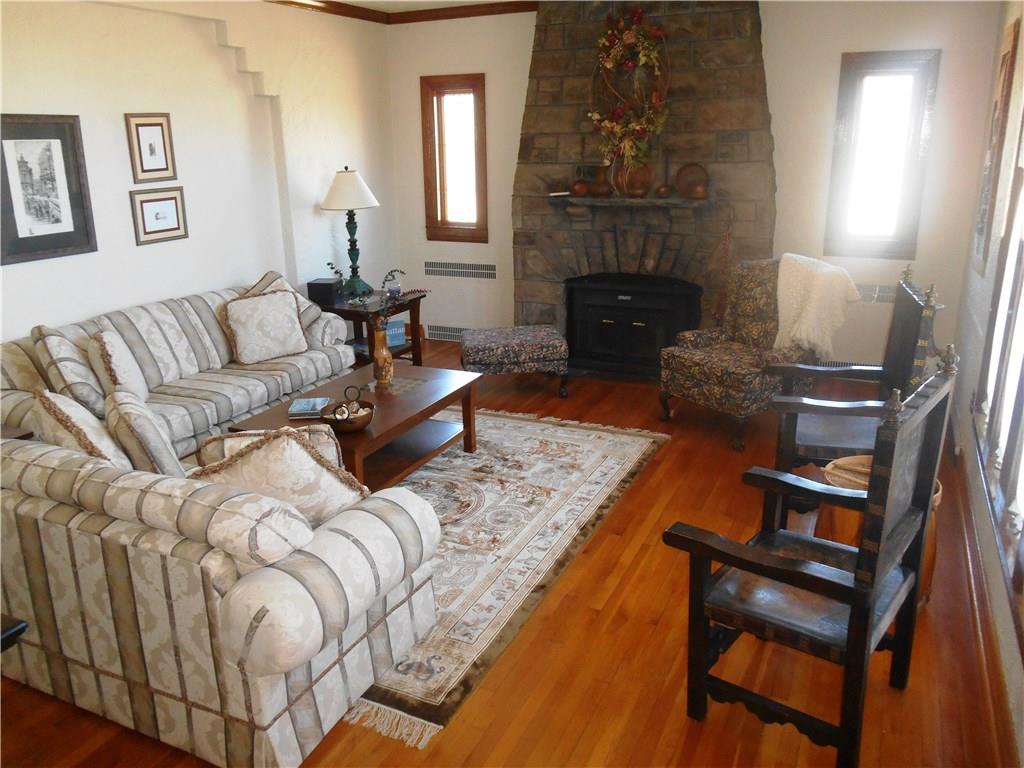 235 Cochran Road Pittsburgh, PA 15228 - Photo 2 of 25 This amazing home has a tremendous old world charm!! The stunning, all stone log burning fireplace is the focal point of the sunken living room. The original hard wood floors SHINE throughout the home!!