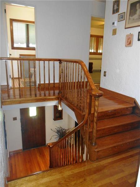 235 Cochran Road Pittsburgh, PA 15228 - Photo 12 of 25 GORGEOUS staircase!! There is a landing 3/4 of the way up that also leads to the fourth bedroom and the remainder of the second floor. NOT your traditional home!