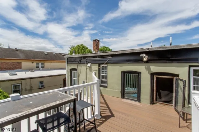 a view of a balcony with two chairs and a table