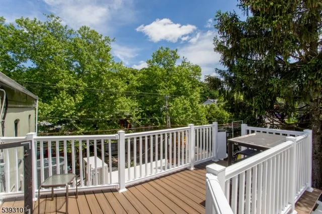a view of a balcony with wooden floor