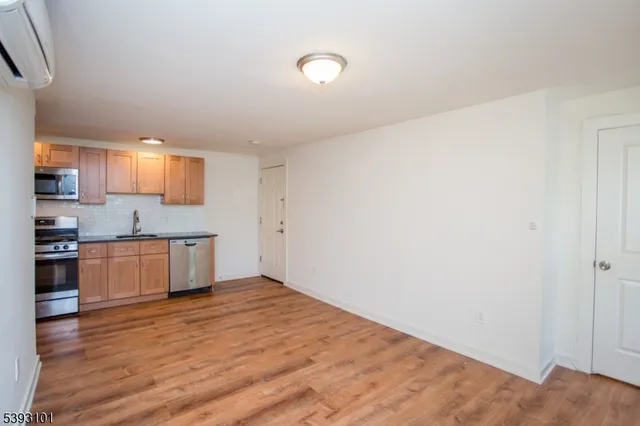 a kitchen with granite countertop a stove and a sink