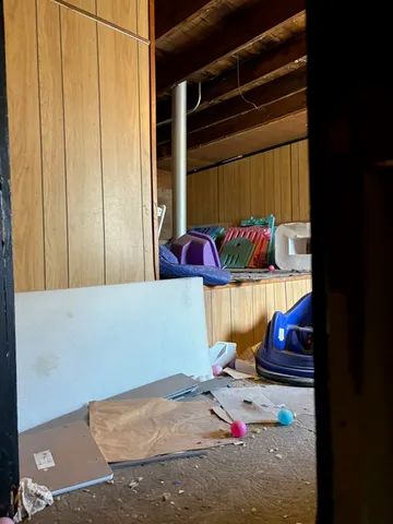 a view of a roof deck with wooden fence and floor