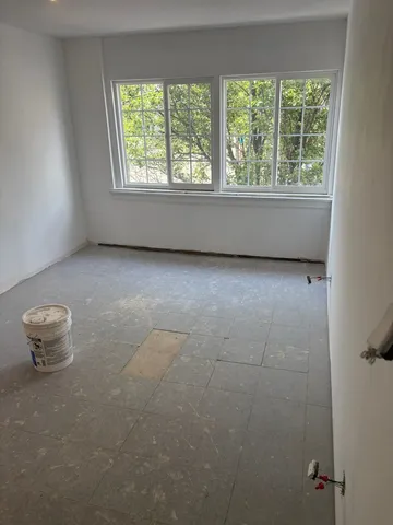 a view of a glass door with a tree