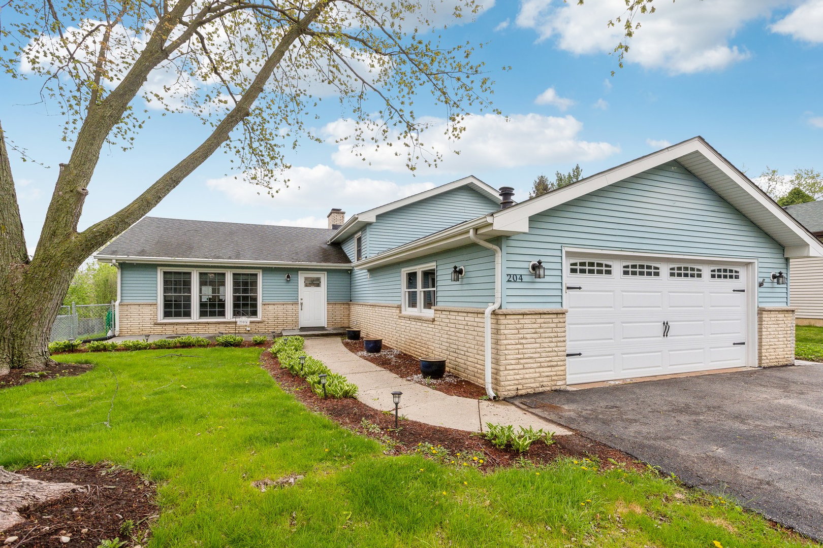 front view of a house with a yard