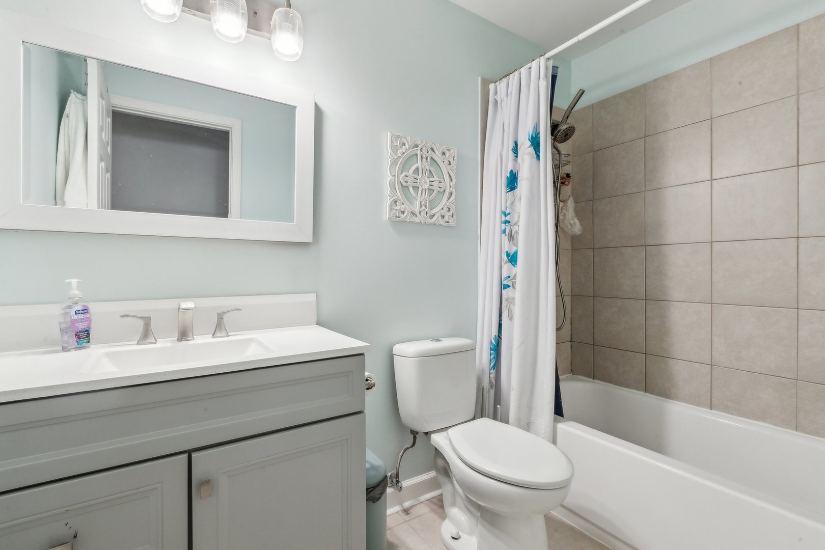 204 Oakleaf Road Lake In The Hills, IL 60156 - Photo 19 of 41 a bathroom with a sink a toilet and shower curtain