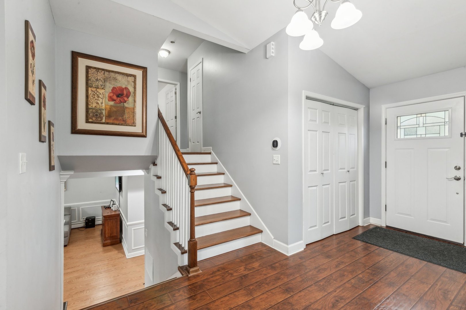204 Oakleaf Road Lake In The Hills, IL 60156 - Photo 2 of 41 a view of a hallway with wooden floor and staircase