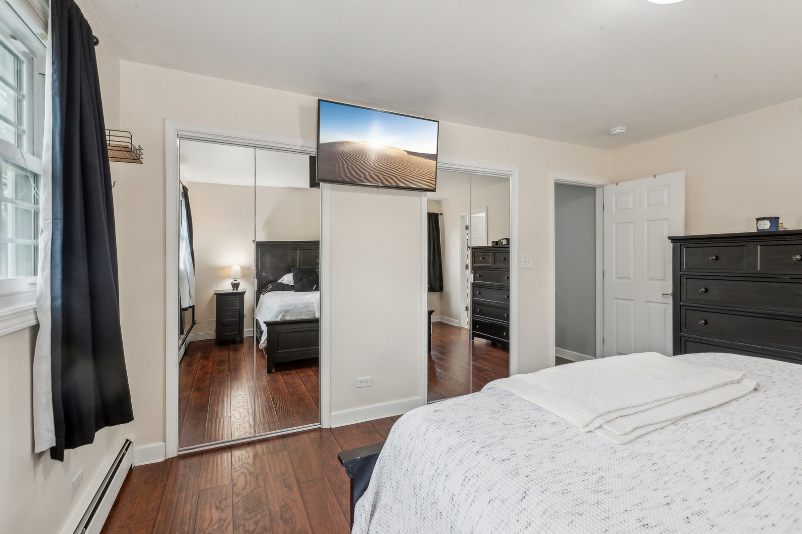 204 Oakleaf Road Lake In The Hills, IL 60156 - Photo 21 of 41 a bedroom with a bed and a large mirror