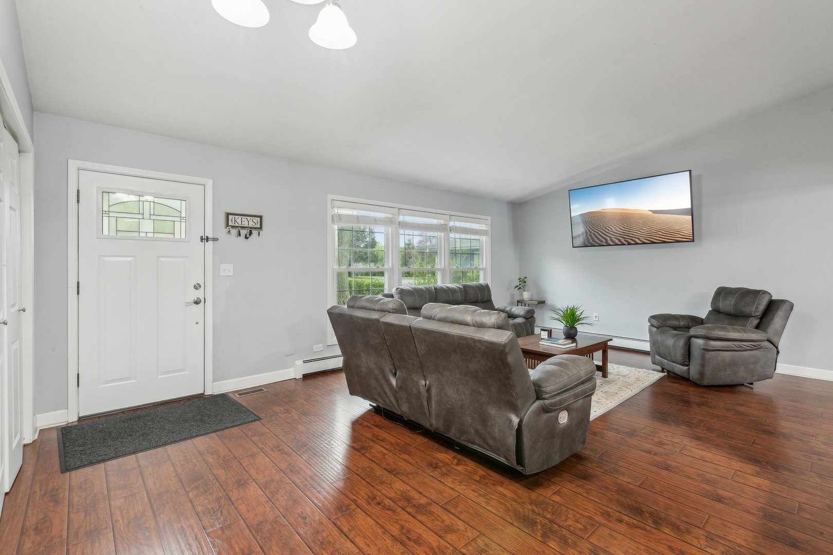 204 Oakleaf Road Lake In The Hills, IL 60156 - Photo 3 of 41 a living room with furniture and a wooden floor
