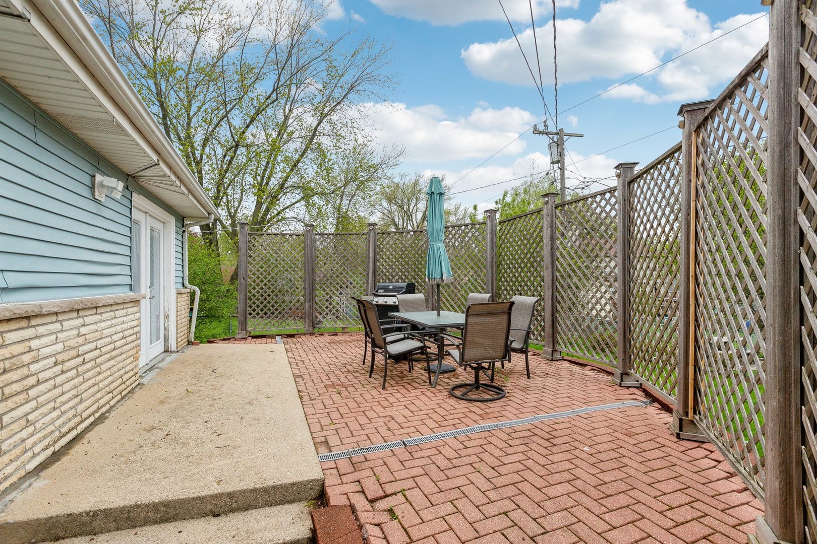 204 Oakleaf Road Lake In The Hills, IL 60156 - Photo 36 of 41 a view of a patio with table and chairs