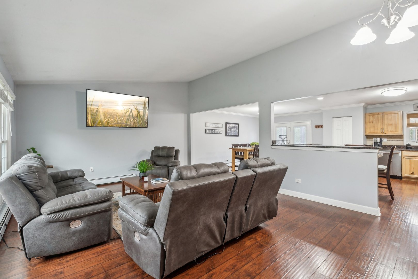 204 Oakleaf Road Lake In The Hills, IL 60156 - Photo 4 of 41 a living room with furniture and a flat screen tv