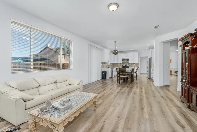 a spacious bedroom with a bed and a window